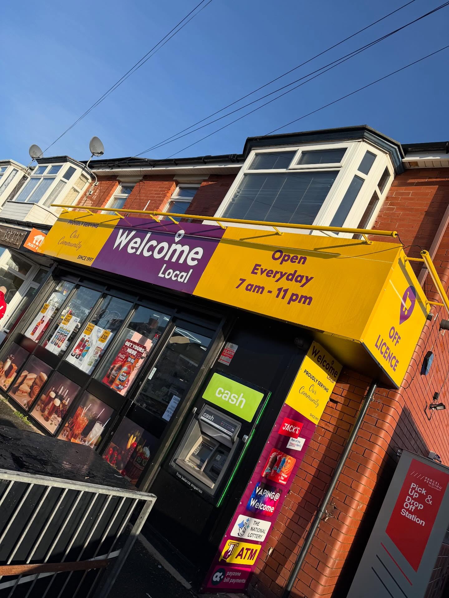 Illuminated off-licence shop front sign designed and fitted by Ashton Signs, Blackpool