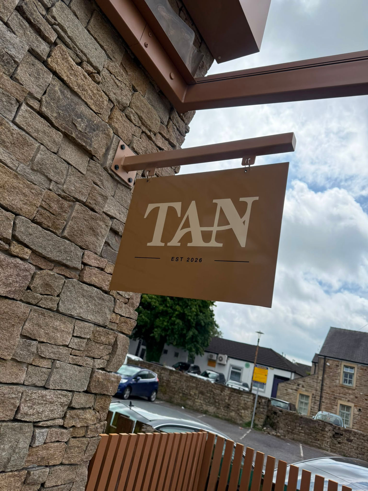 Hanging business sign for TAN designed and fitted by Ashton Signs